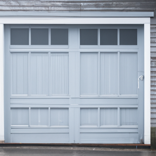 Port Townsend Victorian home with a visible painted steel garage door, foggy coastal sky and wet wooden siding.